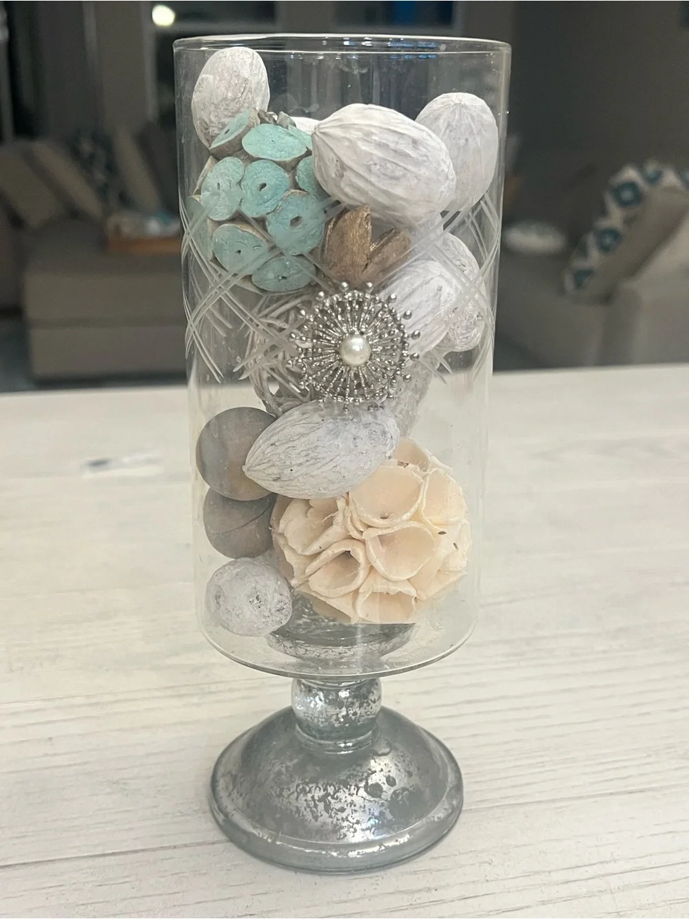 Glass Pedestal Hurricane Vase with Decorative White, Cream and Aqua Fillers
